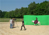 Riding in front of the green screen which will have a Victorian scene superimposed on the background.
